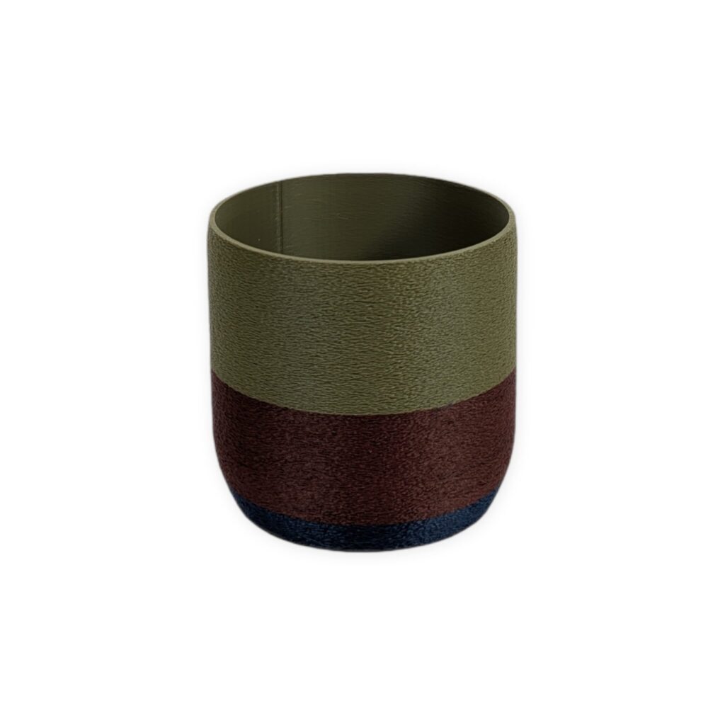 Golden Hour collection planter, 3D-printed with textured horizontal stripes in navy, maroon, and olive